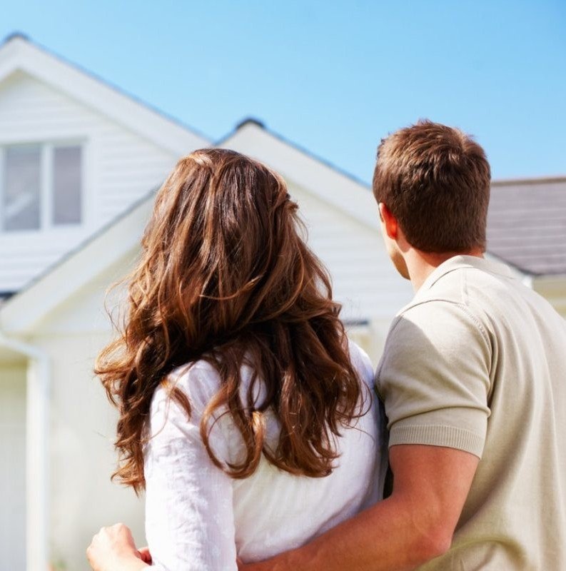 Hands holding a secure house icon